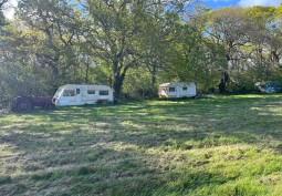 derelict caravans in a field - isle of wight film location