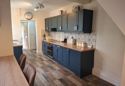 Kitchen (Coloured units), Kitchen (Modern), Kitchen (Electric/Induction Hob) at Victorian Stone Built Home For Filming, South Yorkshire
