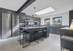 Kitchen (With Island), Kitchen (Coloured units), Kitchen (Modern), Skylight, Kitchen (Electric/Induction Hob) at Stylish Five Bedroom Home For Filming, Essex