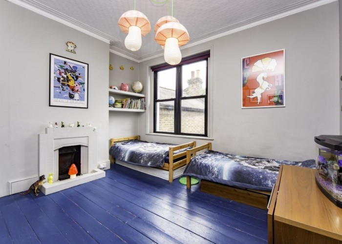 27. childs bedoorm with twin single beds and blue painted floor