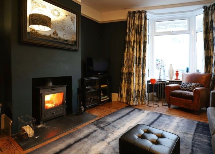 1. Lounge with daek contemporary paint colour wood burner. great for Xmas filming