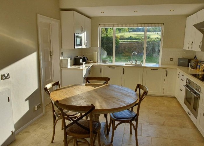 24. Kitchen (Cream or White units), Kitchen With Table, Kitchen (2 Kitchens), Kitchen (Electric/Induction Hob)