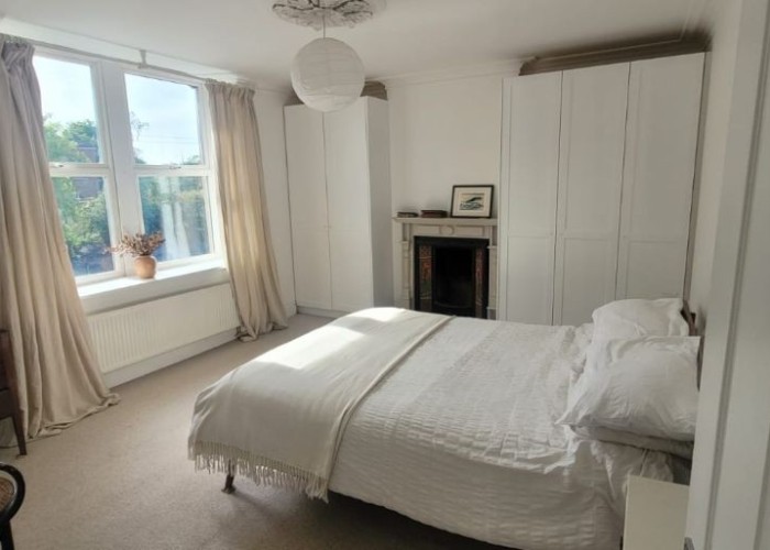 13. film in this spacious bedroom - high ceilings, neutral decor, spacious