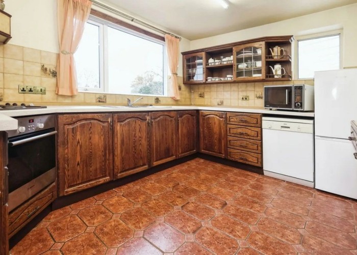 6. dated kitchen with wooden door fronts and separate appliances