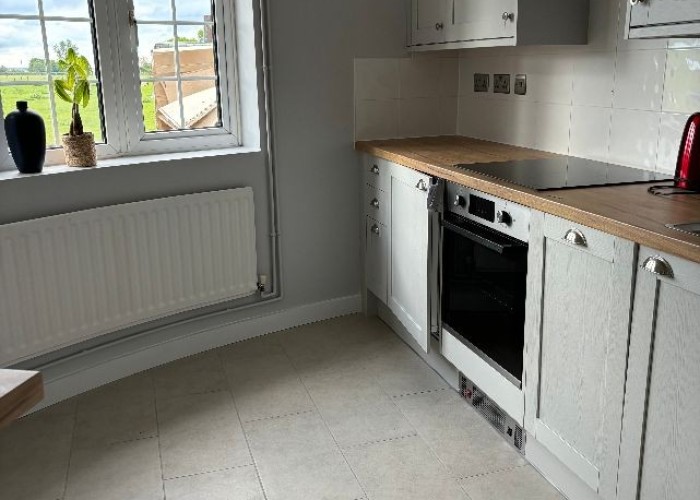 4. Kitchen (Cream or White units), Kitchen (Electric/Induction Hob)