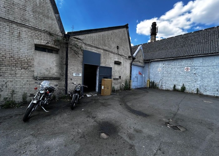 Motorcycle Workshop On Industrial Estate For Filming