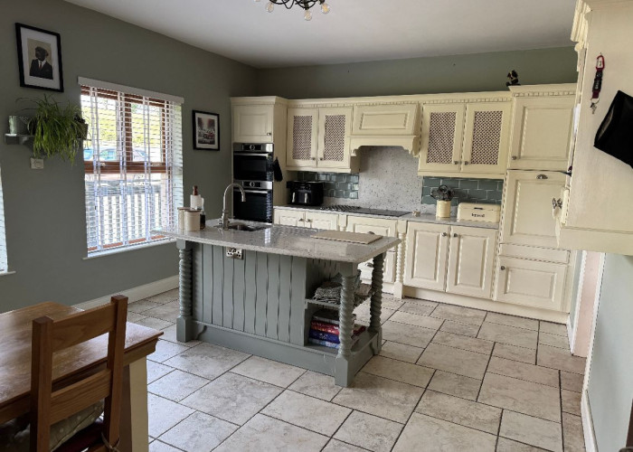 11. Kitchen (With Island), Kitchen (Cream or White units), Kitchen With Table, Kitchen (Electric/Induction Hob)