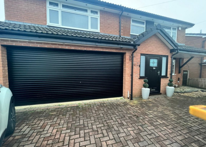 Detached Home With Double Garage in Residential Setting