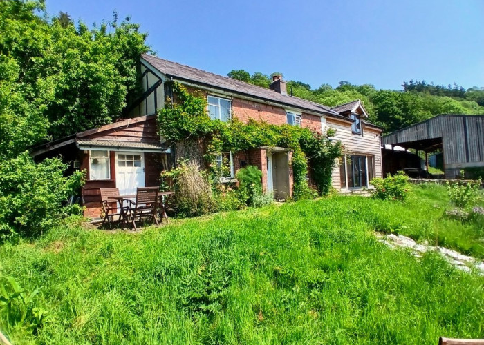 Period cottage with various barns for filming