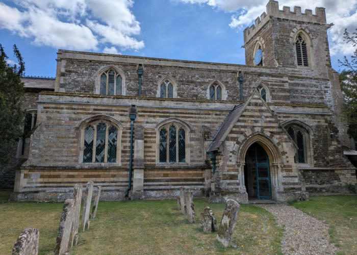 Church with Graveyard On a Quite Road for Filming