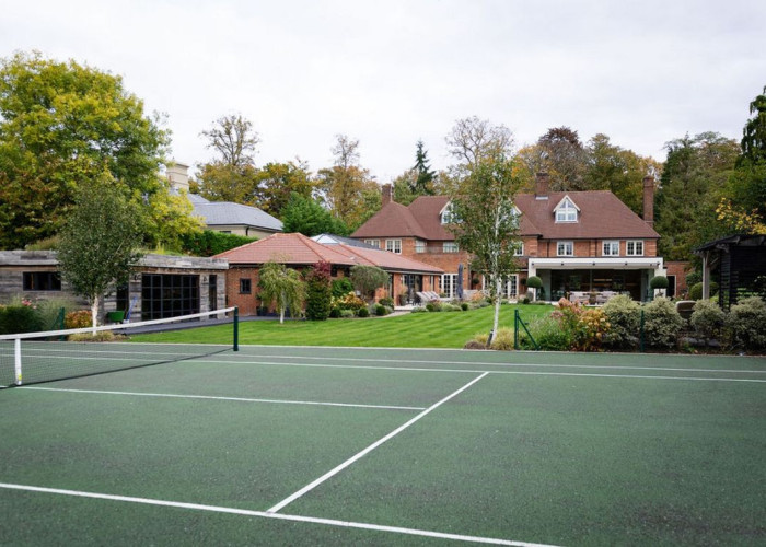 Tennis court, Sports venue at Beautiful Contemporary Home In Buckinghamshire For Filming, Buckinghamshire