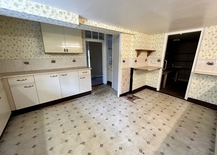 Kitchen (White units) at A Deserted Timeworn Farmhouse Frozen In Decades Past For Filming, Hertfordshire